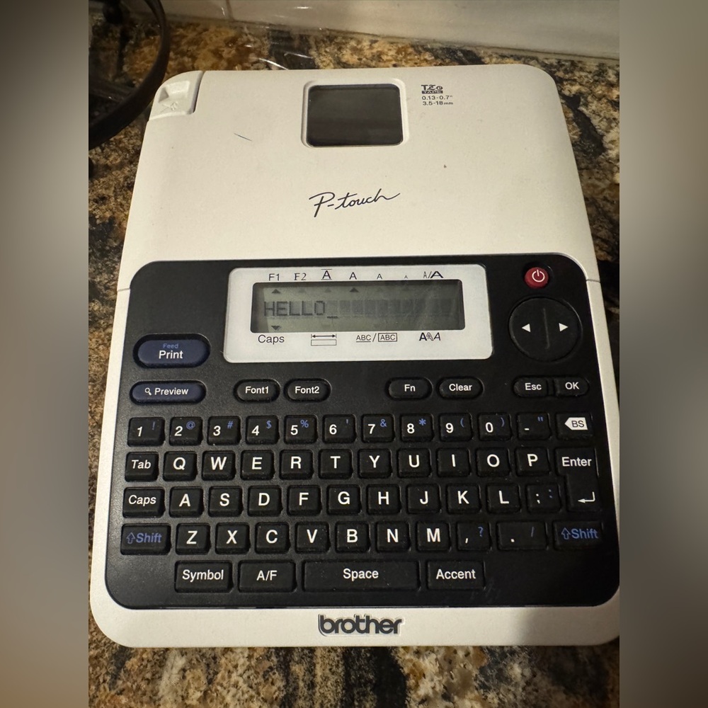 Brother P-touch Electronic Label Maker tested‎ works. Batteries is not included.